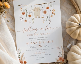 May include: A white rectangular baby shower invitation card featuring a watercolor illustration of a branch with hanging dried flowers and a baby onesie. The text reads Falling in love with baby William, Alana & Chris, September 26, and event details.