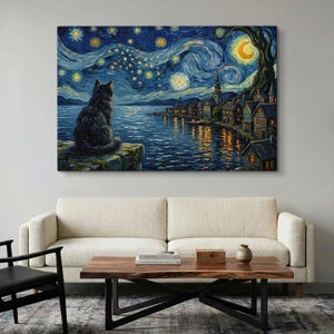 May include: A rectangular wall art print featuring a dark, fluffy cat sitting on a ledge overlooking a body of water at night. The scene depicts a swirling, starry sky with a crescent moon, a dark tree, and a small village with glowing windows.
