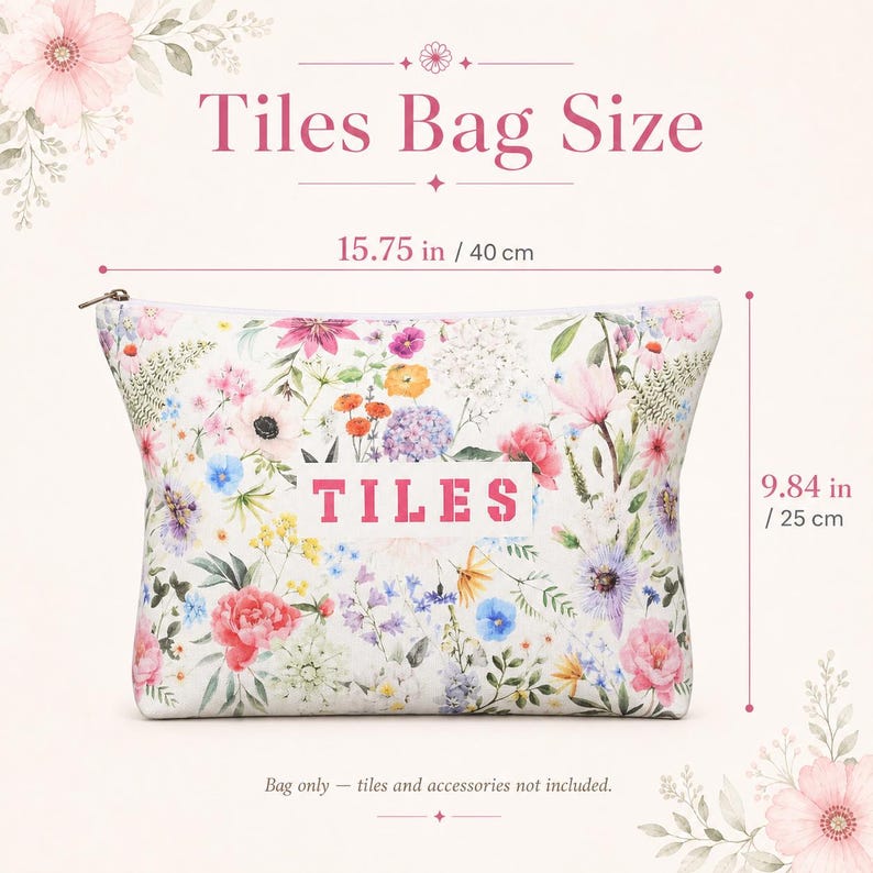 May include: A rectangular zippered pouch featuring a colorful floral print on a white background with the word TILES printed in pink in the center. The bag measures 15.75 inches in width and 9.84 inches in height as indicated by the text.