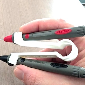 May include: Two gray Mastech multimeter probes with red and black tips, each fitted with a white 3D-printed plastic clip attachment. The probes feature a textured grip and the brand name Mastech printed in red or black on the handle surface.