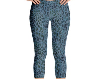 May include: Blue cropped leggings with a leopard print pattern.