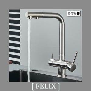 May include: A brushed stainless steel kitchen faucet with a high-arc spout and a single lever handle. Water flows from the aerator. The faucet features a logo reading BERLIN FAUCET with a map of Germany and the text FELIX at the bottom.