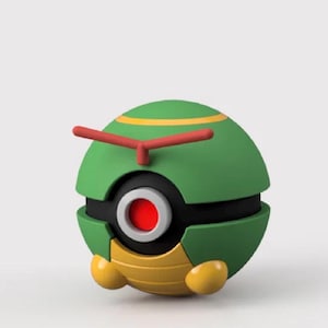 May include: A spherical green figurine with a yellow band near the top and a red T-shaped antenna. The center features a black circular band with a white-rimmed red eye. The base is yellow with horizontal ridges and two small yellow rounded feet.