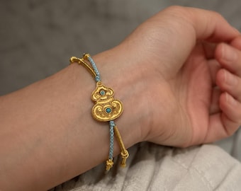 Bracelet Wu Lou en or : cordon tressé bleu bijoux porte-bonheur