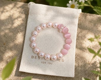 Pulsera de perlas rosa pastel: elegante joya con cuentas estilo ojo de gato para ella.
