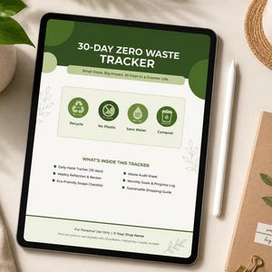 May include: A digital 30-day zero waste tracker displayed on a tablet. The screen features green and white text and icons related to recycling, reducing plastic, saving water, and composting. A white stylus, a plant, and a notebook are also visible.