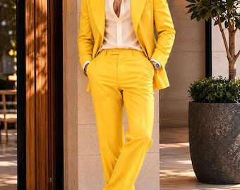 May include: A bright yellow suit with a matching jacket and trousers, paired with a white dress shirt and white shoes. The suit is tailored and has a modern fit. The image includes the text "IMPERIAL ATTIRE - TAILORED TO ELEVATE".