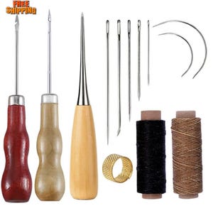 May include: A leathercrafting kit featuring various needles, awls with wooden handles, spools of black and brown thread, and a gold thimble. The kit includes curved and straight needles for sewing and leatherwork projects.