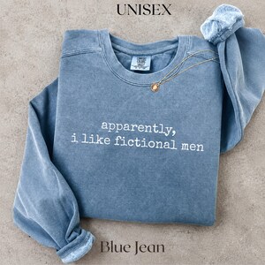 Blue Jean unisex sweatshirt with "apparently, I like fictional men" text.