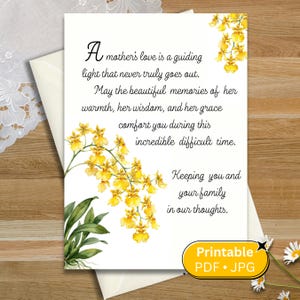 Peut inclure: Une carte de condoléances avec une illustration aquarelle d'orchidées jaunes et le texte : A mother's love is a guiding light that never truly goes out. May the beautiful memories of her warmth, her wisdom, and her grace comfort you during this incredible difficult time. Keeping you and your family in our thoughts.