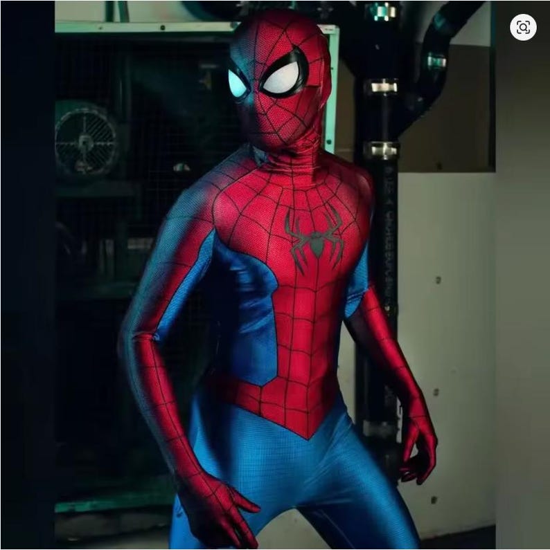 May include: A red and blue Spider-Man costume. The costume has a red torso and head with a black spider emblem, and blue arms and legs. The mask has white eye lenses. The costume is form-fitting and appears to be made of a stretchy material.