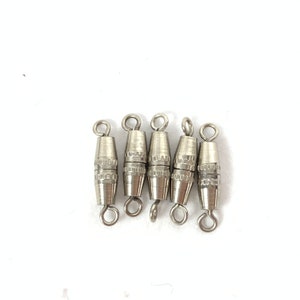 May include: Six silver-toned metal clasps with a barrel shape and a loop on each end. The clasps are designed to be used for jewelry making.