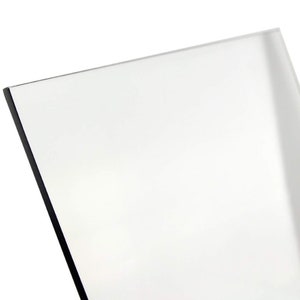 May include: A clear, rectangular sheet of acrylic plastic.