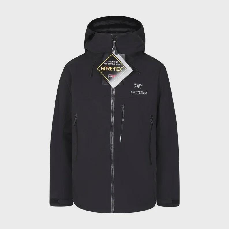 May include: Black hooded jacket with a full-length zip, two side pockets, and a chest pocket. The jacket features the Gore-Tex logo and the Arc'teryx logo. Designed for outdoor activities.