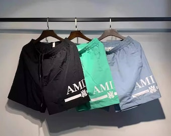 Amiri Logo-Print Shell Badeshorts | Schwarz, Grün & Hellblau, Luxus Streetwear Bademode