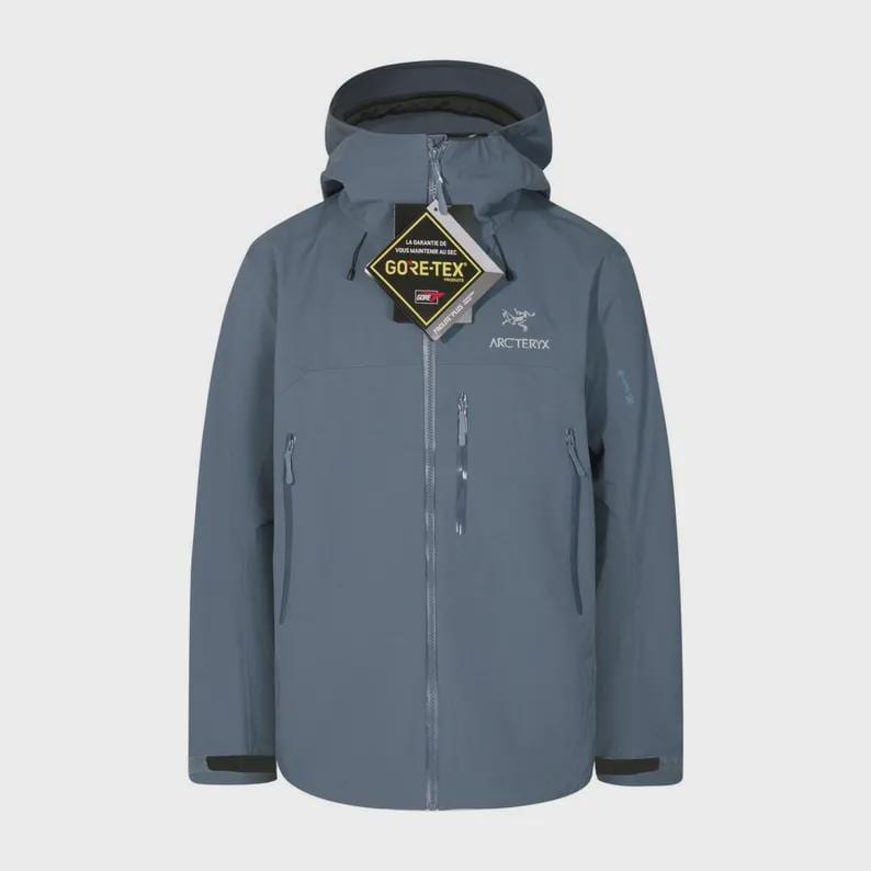 May include: A slate blue hooded jacket with a full-length zip, multiple pockets, and the "GORE-TEX" and "Arc'teryx" logos. The jacket has a streamlined design, suitable for outdoor activities. The jacket is made of a durable, waterproof material.