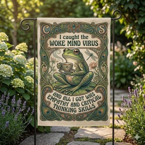 May include: A garden flag with a green frog holding a teacup, with the text "I caught the WOKE MIND VIRUS" and "AND ALL I GOT WAS EMPATHY AND CRITICAL THINKING SKILLS". The flag has an ornate design with floral and dragonfly elements.