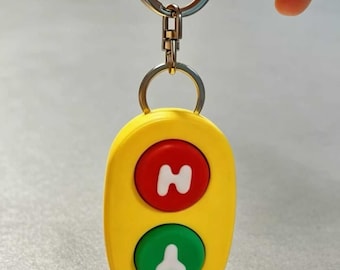 3D-printed "Talking Yes/No" button keychain (inspired by the "Dance Mode" episode of *Bluey*); supports USB-C charging.
