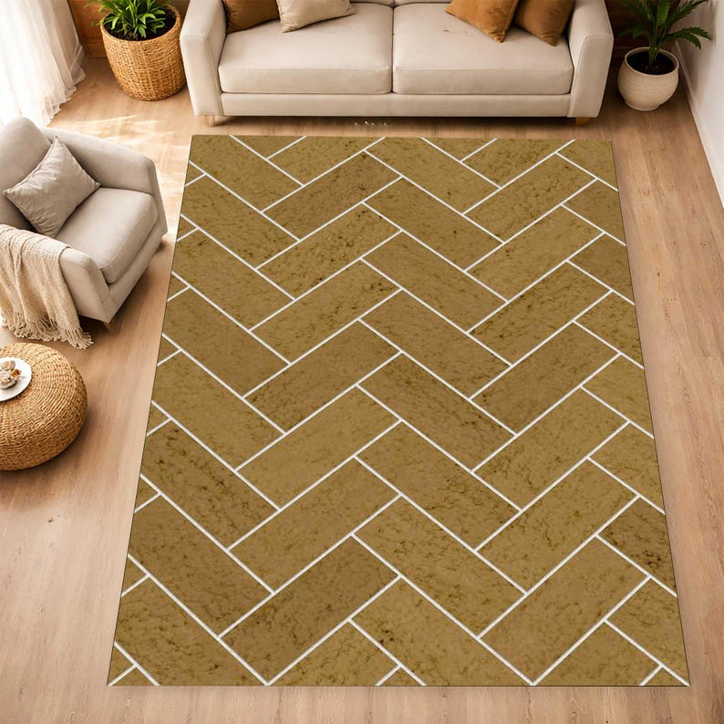 May include: A rectangular area rug featuring a repeating herringbone pattern. The design consists of tan, textured rectangular blocks separated by thin white lines, creating a structured geometric layout across the entire surface of the rug.