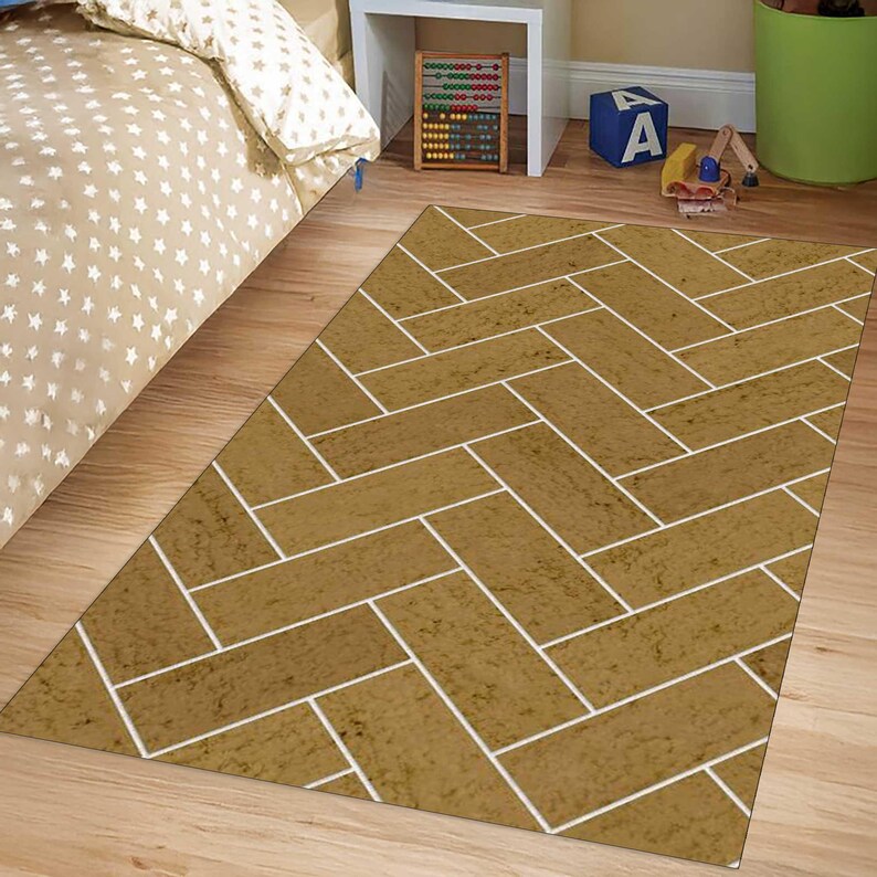 May include: A rectangular area rug featuring a brown herringbone pattern with white grout lines. The design mimics the appearance of brick or stone tiles arranged in a classic interlocking formation, covering the entire surface of the floor covering.