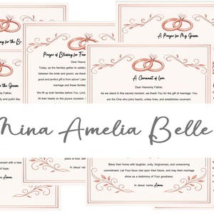 May include: A collection of rectangular paper cards featuring rose gold line art of two interlocking wedding rings and decorative flourishes at the top and bottom. Each card contains printed religious text and the name Mina Amelia Belle.