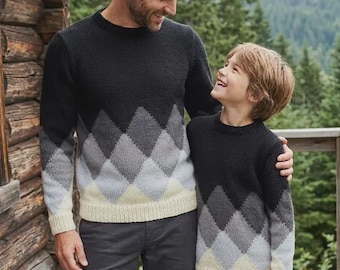 May include: Two matching long-sleeve knit sweaters featuring a black upper section that transitions into a gray and cream diamond argyle pattern. The sweaters have a crew neckline, ribbed cuffs, and a ribbed hem, designed with a gradient color scheme.