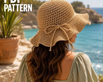 May include: A tan crochet sun hat featuring a wide, wavy brim and a decorative bow detail tied around the crown. The text PDF PATTERN is visible in the upper left corner. The hat is constructed with a textured, open-weave stitch pattern.