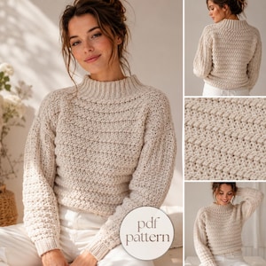 May include: A cream-colored long-sleeve sweater with a mock neck and a textured knit pattern. The garment features ribbed cuffs and a ribbed neckline. A circular white graphic overlay in the bottom right corner displays the text pdf pattern.