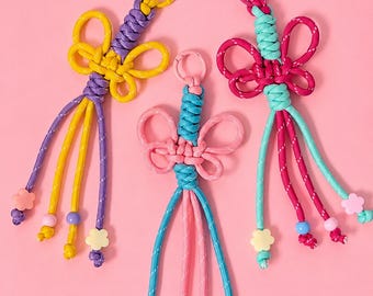 Whimsy Bogen Knoten Schlüsselanhänger | Niedlicher Taschenanhänger aus Paracord | Y2K Coquette Schlüsselanhänger Zubehör | Bunter Harajuku Style Anhänger | KöKö Syréne
