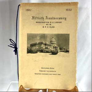 May include: A vintage program for the Fiftieth Anniversary of the Washington, D.C. Lodge No. 15 of the Benevolent and Protective Order of Elks, held at the Mayflower Hotel on February 11, 1932. The program features a black and white image of the United States Capitol Building.