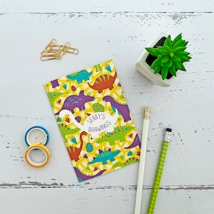 Cuaderno de diseño de dinosaurios - regalo de dinosaurios para niño, niña o amante de los dinosaurios - papelería para niños
