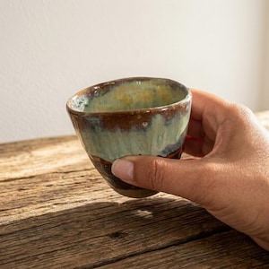 Handmade Handleless Stoneware Coffee Cup: Amber Turquoise Drip Glaze, Thumbprint (5 oz)