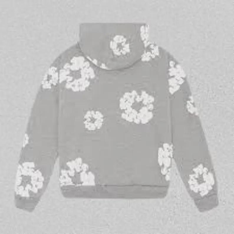 May include: A grey hoodie adorned with white floral designs. The hoodie has a drawstring hood and long sleeves. The white floral patterns are spread across the front, back, and sleeves of the garment.