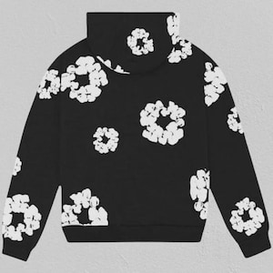 May include: Black hoodie with a white floral design. The sweatshirt has a high collar and is adorned with white, flower-shaped patterns across the front, back, and sleeves. The cuffs and hem are plain black.