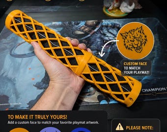 May include: A cylindrical 3D printed playmat holder featuring a bright orange lattice exterior and a black interior. The holder includes a circular end cap with a custom wolf graphic. Text on the image includes CUSTOM PLAYMAT HOLDER and PLEASE NOTE: PLAYMATS ARE NOT INCLUDED. THIS LISTING IS FOR THE PLAYMAT HOLDER ONLY.