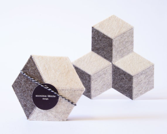 Set of hexagonal light grey felt coasters