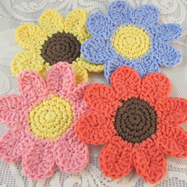 Pretty Daisy crocheted coasters set of four handmade pink yellow orange blue cotton crochet summer flowers