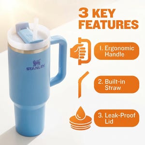 May include: A light blue Stanley tumbler with a white lid and a built-in straw. The tumbler has an ergonomic handle and features the text "3 KEY FEATURES" with descriptions: ergonomic handle, built-in straw, and leak-proof lid.