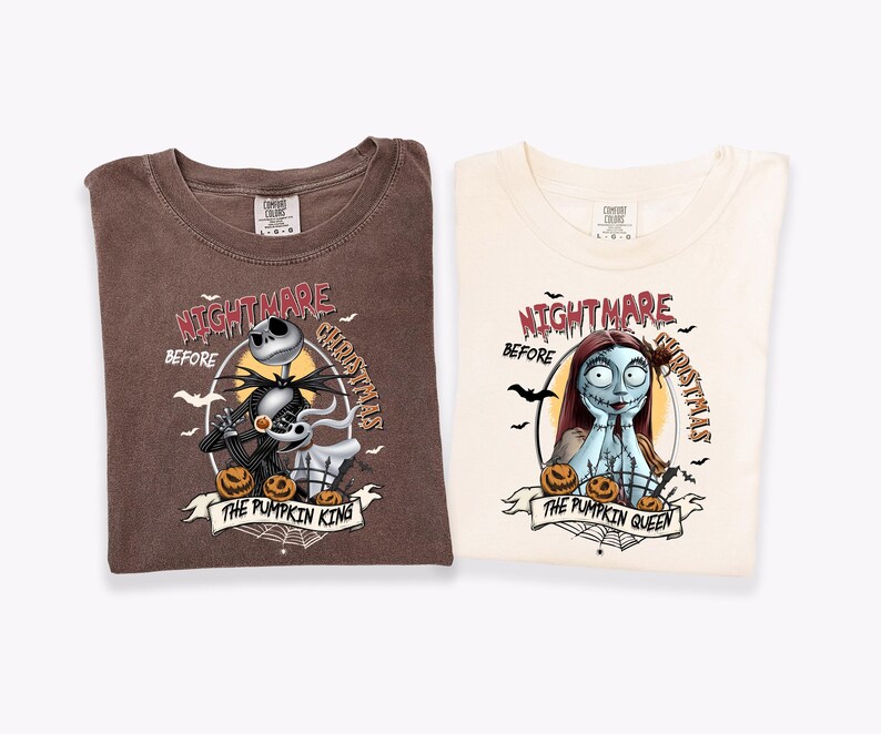 May include: A brown t-shirt and a cream t-shirt featuring graphic prints from The Nightmare Before Christmas. The brown shirt displays Jack Skellington and Zero with the text The Pumpkin King. The cream shirt shows Sally with the text The Pumpkin Queen.