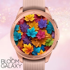 May include: A rose gold smartwatch with a textured silicone band features a digital watch face displaying a vibrant, overlapping pattern of maple leaves in shades of yellow, orange, purple, blue, pink, and green. The text BLOOM GALAXY is visible.