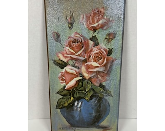 May include: A rectangular wall plaque featuring a painting of pink roses in a dark blue vase. The roses are in various stages of bloom with green leaves. The background is a soft gradient of light green and gold. The artist signature is visible.