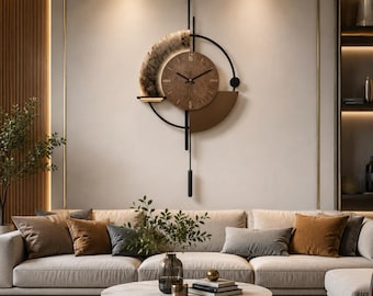 May include: A wall clock featuring a circular brown face with black hands, mounted on a black metal frame. The design includes a textured semi-circular accent, a solid brown semi-circle, and a vertical pendulum rod extending downwards.