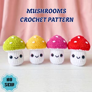 May include: Four crocheted mushroom figures with smiling faces. The mushroom caps are in green, yellow, pink, and red, each with white polka dots. The text "MUSHROOMS CROCHET PATTERN" is above the mushrooms.
