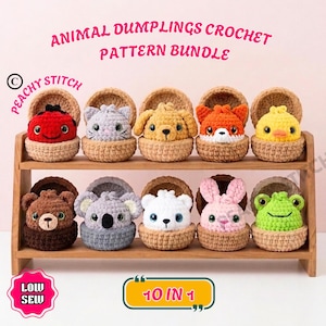 May include: A collection of ten crocheted animal dumplings in a wooden display stand. The text reads ANIMAL DUMPLINGS CROCHET PATTERN BUNDLE, PEACHY STITCH, LOW SEW, and 10 IN 1. The animals include a ladybug, cat, dog, fox, chick, bear, koala, polar bear, rabbit, and frog.