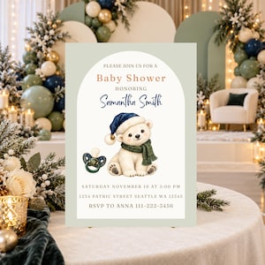 Puede incluir: Una tarjeta de invitación para baby shower con borde verde salvia y centro blanco arqueado. Incluye un osezno polar con gorro azul marino y bufanda verde, un chupete y el texto: Please join us for a Baby Shower honoring Samantha Smith, Saturday November 19 at 3:00 PM, 1234 Patric Street Seattle WA 12345, RSVP to Anna 111-222-3456.