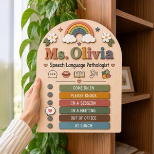 May include: An arched wooden sign featuring the text Ms. Olivia Speech Language Pathologist, a rainbow, flowers, and icons for speech, lips, book, ear, and puzzle. It includes a status board with options: Come On In, Please Knock, In A Session, In A Meeting, Out Of Office, and At Lunch.