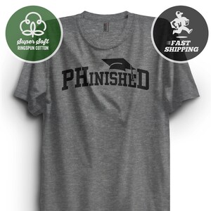 May include: Gray t-shirt with the text "PHINISHED" in black letters with a graduation cap above the text.