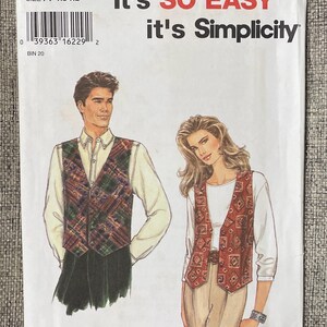 May include: A vintage sewing pattern featuring illustrations of a man and woman wearing vests. The pattern includes the text "It's SO EASY it's Simplicity" in red and black. The pattern number is 9285, size XS-XL.