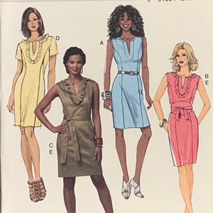 May include: A sewing pattern featuring illustrations of four different dresses. The dresses are in various colors, including yellow, light blue, and pink. Each dress has a V-neckline and a different design, with some featuring ruffles or belts.
