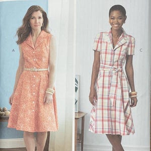 May include: A sewing pattern from Butterick, B6843, featuring two dress designs. One is a sleeveless, button-down dress with a floral pattern. The other is a short-sleeved plaid dress with a tie waist. The pattern size is F5 (16-18-20-22-24).